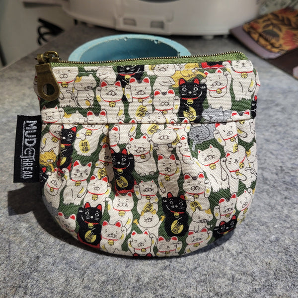 Maneki Neko, Melina