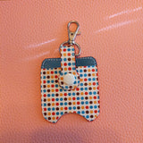 Dots Sanitizer Bottle and Holder