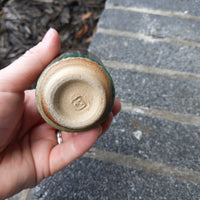 green/rust cup