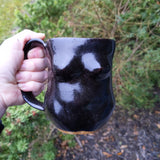 Female form, black glaze Mug